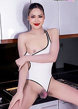 In this hot solo set, all-natural ladyboy Nadia poses in the kitchen, spreads her yummy ass to show her tight hole, and strokes her hard cock