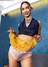 Dressed in a mini skirt and heels, ladyboy Linry shows off her slim body and her long cock, spreads her tight ass and plays with a toy