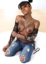 Watch tattooed black tgirl Cherri Curves posing, showing off that killer body and spreading her big ass with that smooth dark and puckered hole!